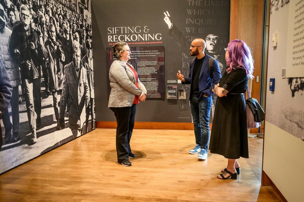 Smith visited the “Sifting & Reckoning” exhibit at the Chazen Museum of Art with, at left, Amy Gilman, director of the Chazen; and Kacie Lucchini Butcher, director of the Public History Project.