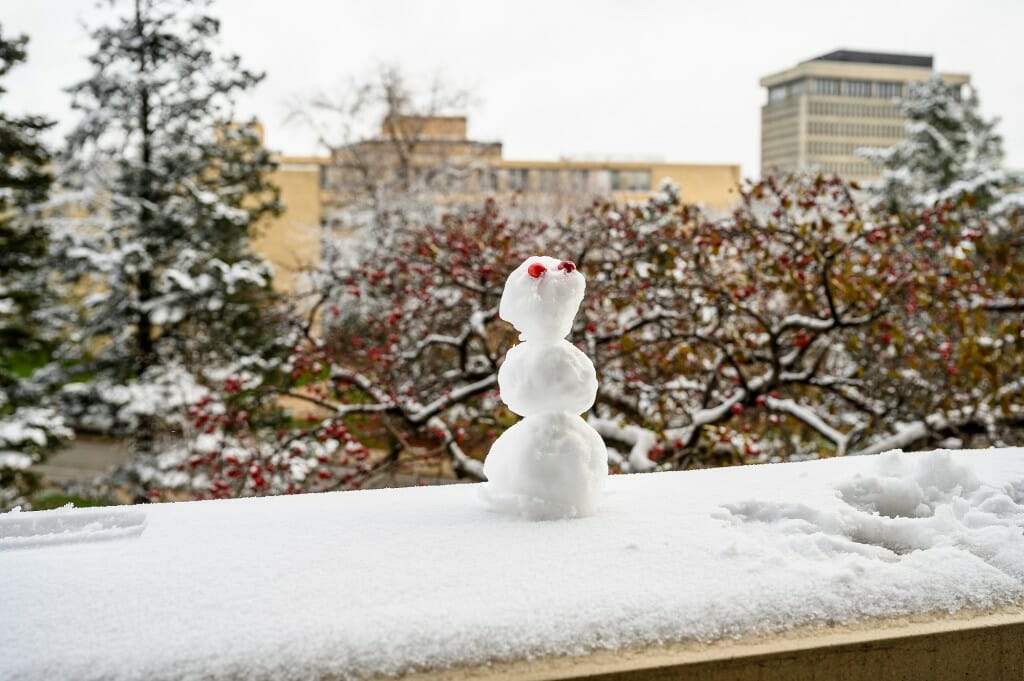 Someone left a sweet little snow person on the railing of Van Hise Hall.