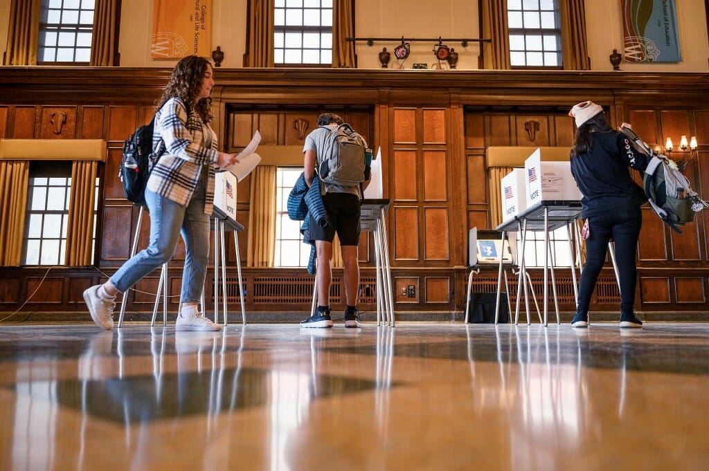 Students fill out midterm election ballots in Tripp Commons at the Memorial Union