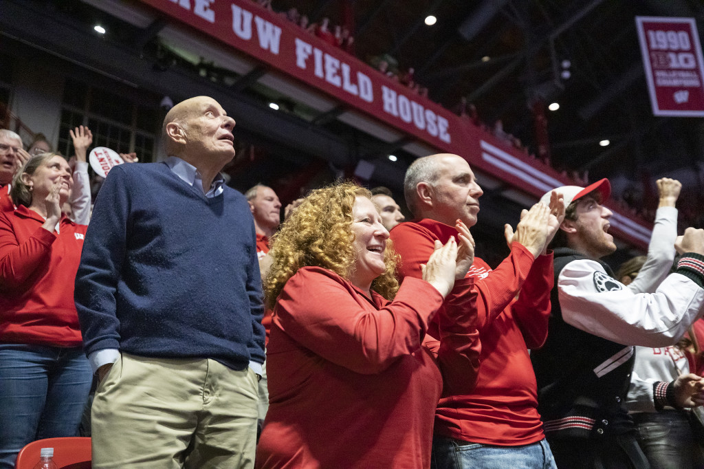 Chancellor Jennifer Mnookin and her husband, Political Science Professor Joshua Foa Dienstag (right), cheer on the Badgers.