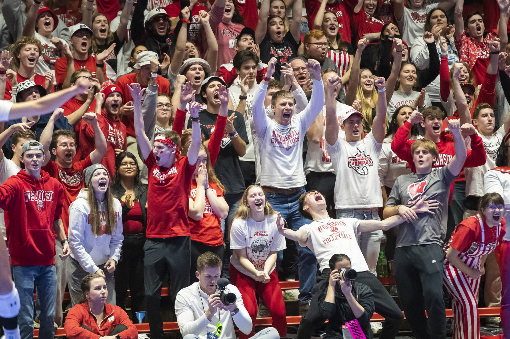 Fans in the AreaRED student section cheer as the Wisconsin Badgers play against Pitt.