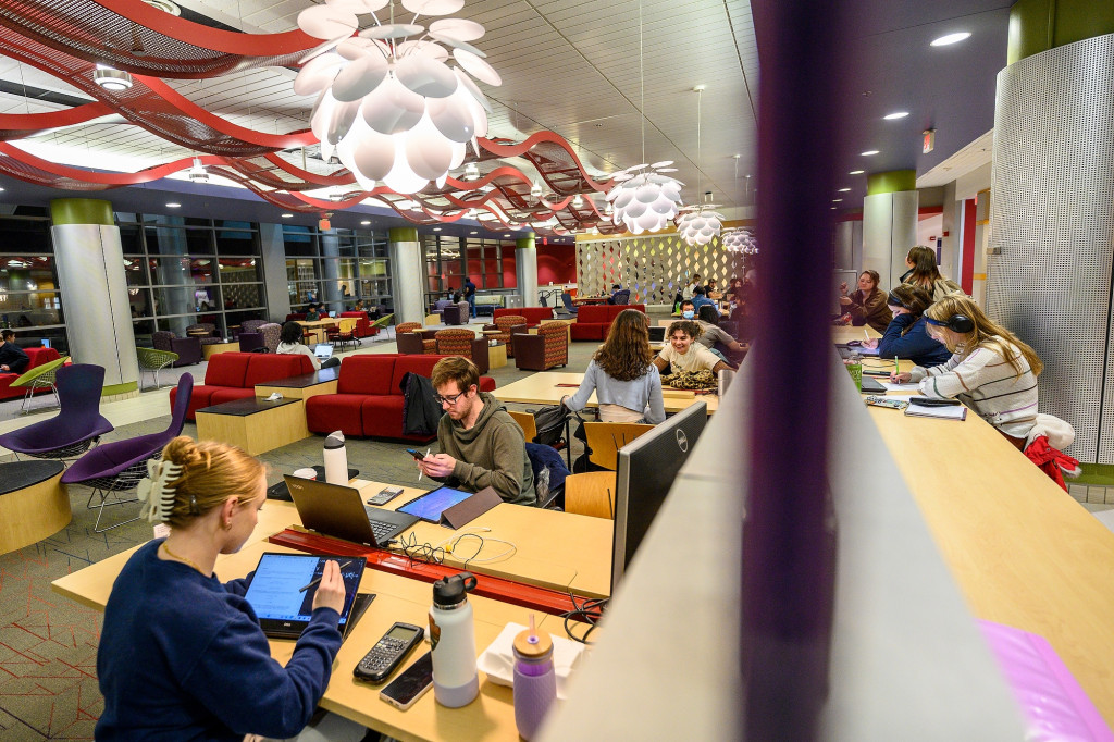 Students fill tables in the Huibregtse Family Commons, working on laptops and with calculators as they study for finals.