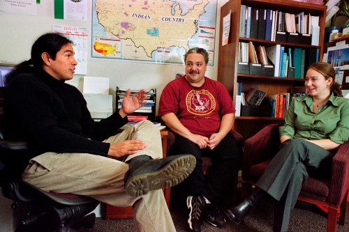 Aaron Bird Bear (left) meets with students Stewart Miller and Star Tourtillott in his office in 2000.