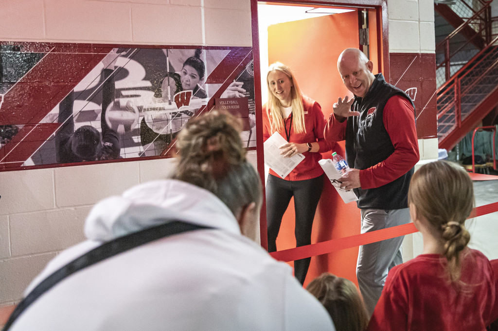 Head coach Kelly Sheffield waves to fans before walking down into the locker room.