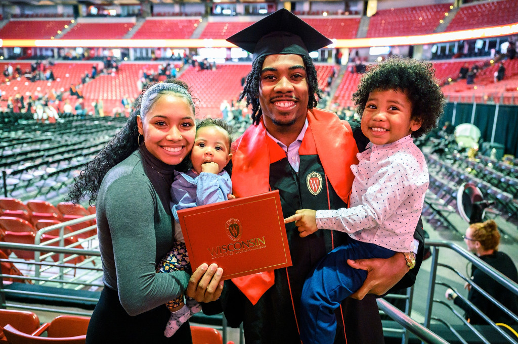 After receiving his business degree at winter commencement, Travian Blaylock celebrates with his family.