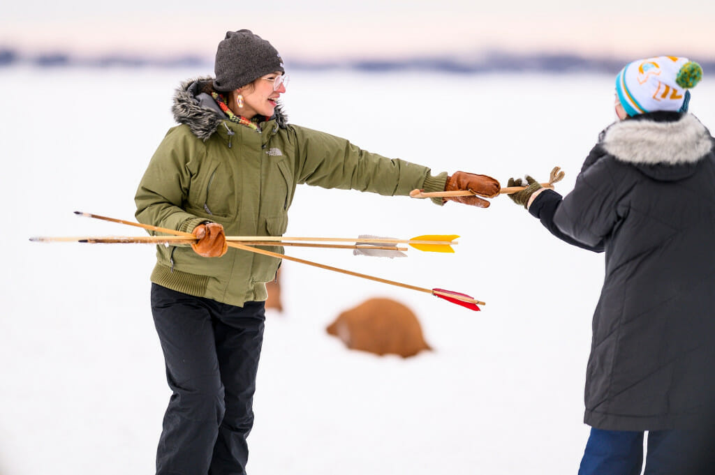 UW undergraduate Abby Sunde, Indigenous UW (NDGNS) fellow and first generation, direct descendent of the Fond du Lac Band of Lake Superior Ojibwe, gathers spears.