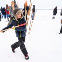 Nine-year-old Emile Pell prepares to throw a snow snake (gooniikaa-ginebig). Snow snakes are carved wooden poles designed to slide well over snow or ice. The purpose of the game is to see who can slide their snow snake the farthest along a specially prepared track.