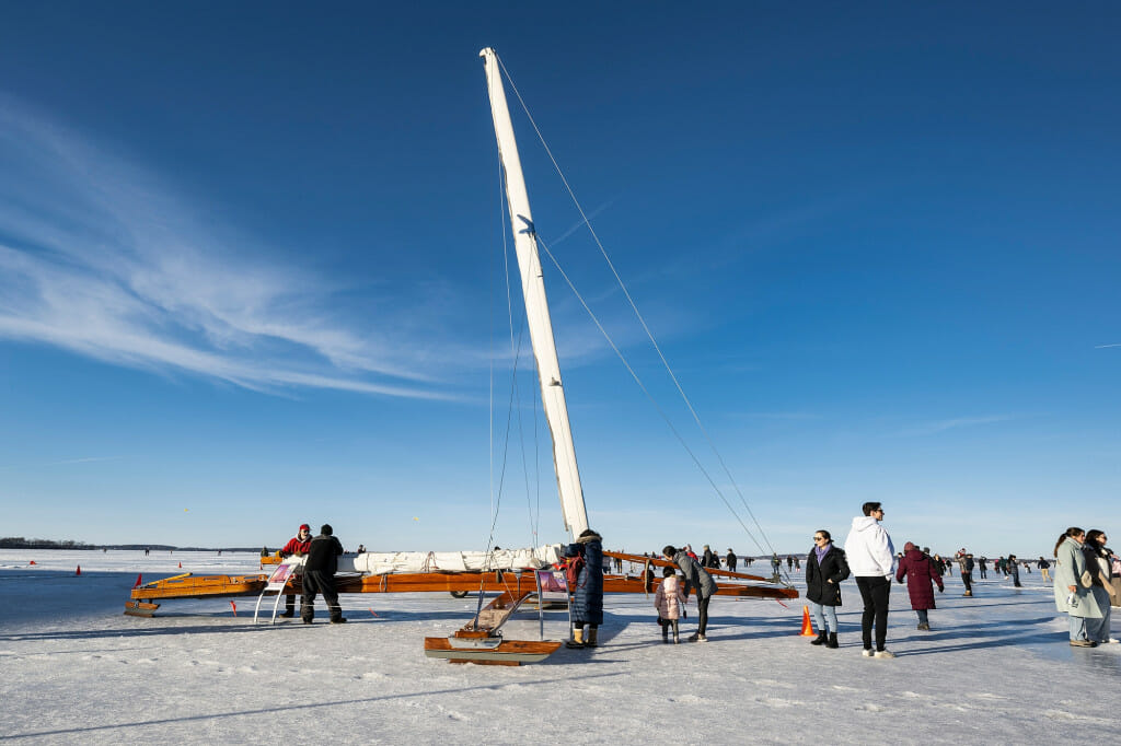 Visitors check out a 39-foot ice boat named the “Mary-B” on frozen and ice-covered Lake Mendota during the Wisconsin Union’s Winter Carnival along the Lake Mendota shore. The display was hosted by the Ice Boat Foundation and the Four Lakes Ice Yacht Club.
