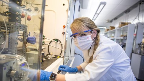 Canan Sener, scientist in the Great Lakes Bioenergy Research Center, prepares an experiment in her lab. Sener’s research focuses on turning plant material into valuable products.