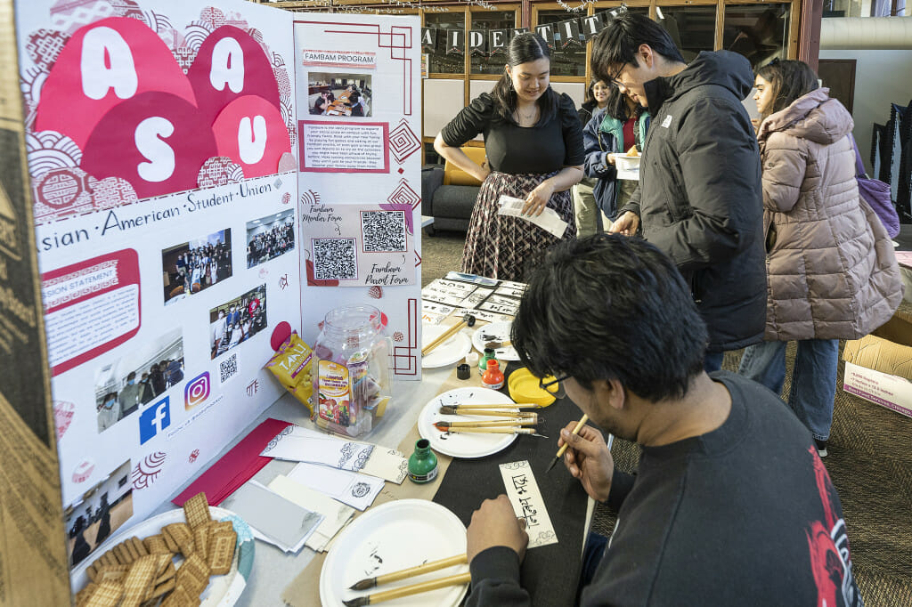 At the Asian American Student Union's booth, students got to use calligraphy brushes (provided by the Center for East Asian Studies) to decorate their own bookmarks.