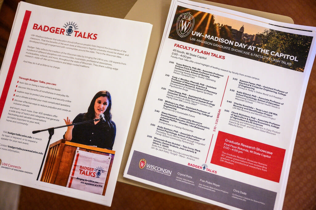 Badger Talks and Faculty Flash Talks handouts spread on a table await visitors during the UW–Madison's Day at the Capitol
