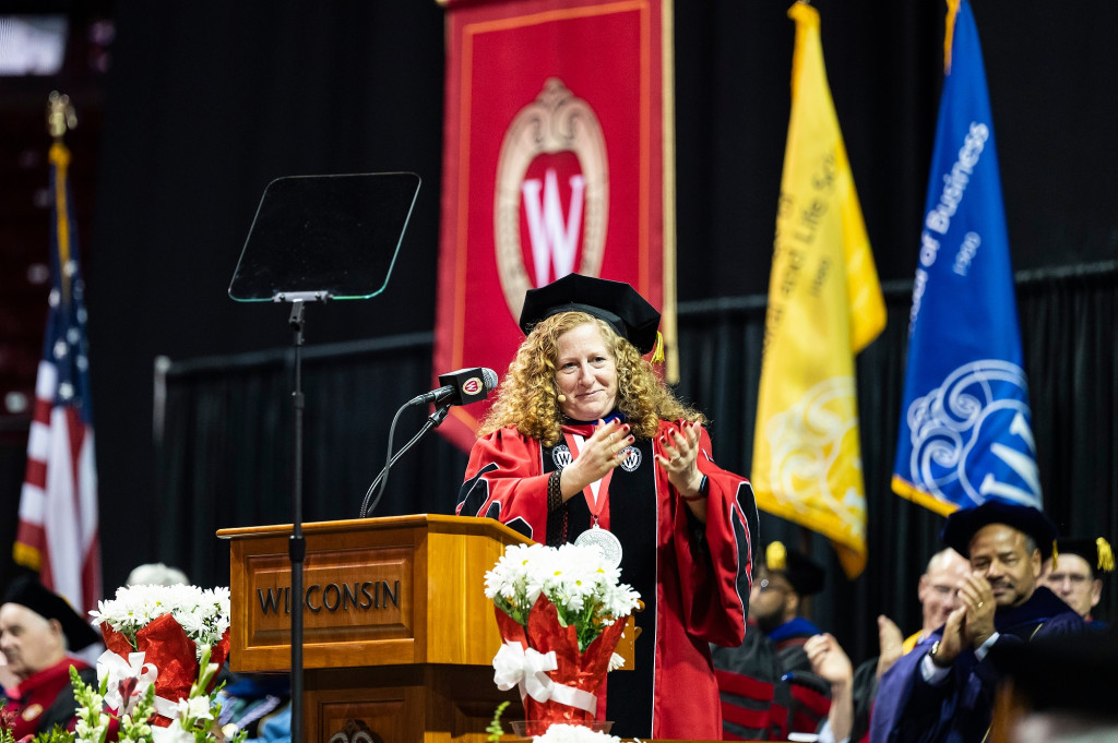 A woman talks at a podium.