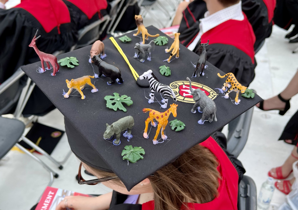 Graduate Abbe Sparling of Pine City, Minnesota, affixed 13 animals to her cap, including a giraffe, a zebra and two hippos. Yep, she’s a zoology and conservation biology major.