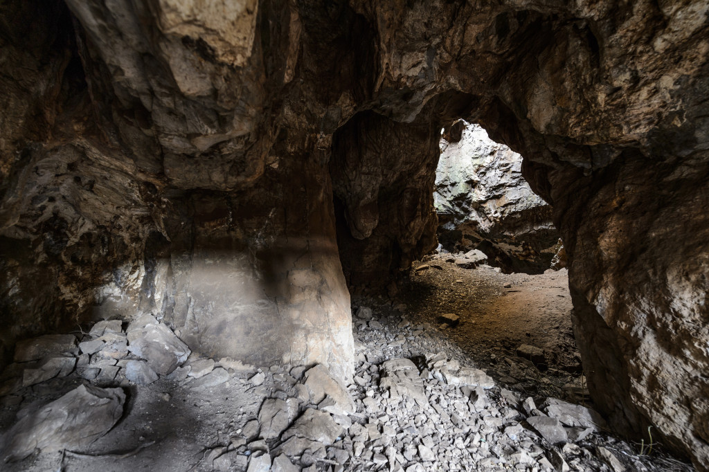An entrance to the Dinaledi Chamber of the Rising Star Cave system. Light from above shines in at the cave entrance.