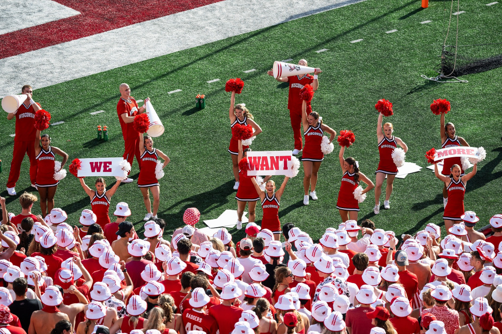 Members of the UW Spirit Squad cheer on the team.