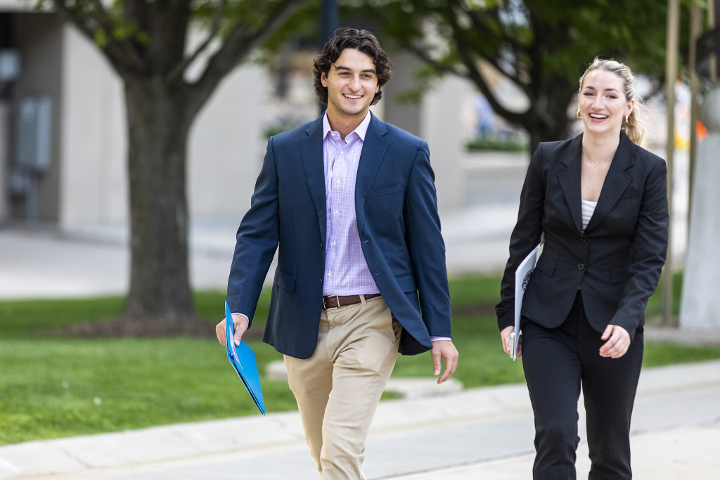 Two people walk side by side.