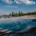 Steam rises over the geyser basin in Yellowstone National Park