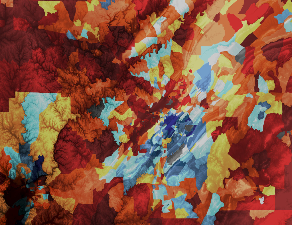 An abstract collage of color patches in autumnal colors of red, orange and yellow fill in a blue background.