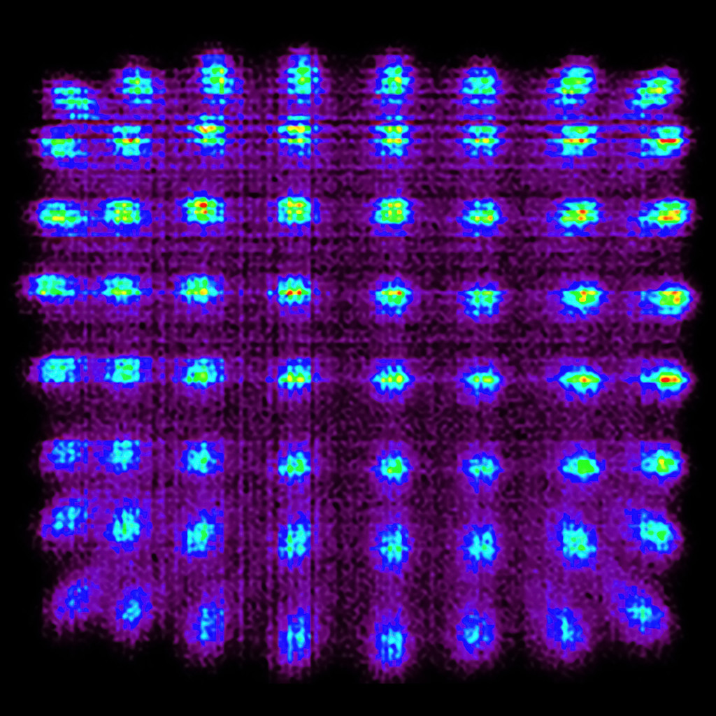 A grid of bright cyan, red and yellow dots glow against a pixelated purple background.