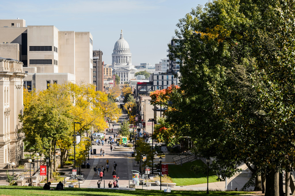 A view of the Wisconsin State Capitol taken from Bascom Hill. A long view up State Street toward the capitol building.