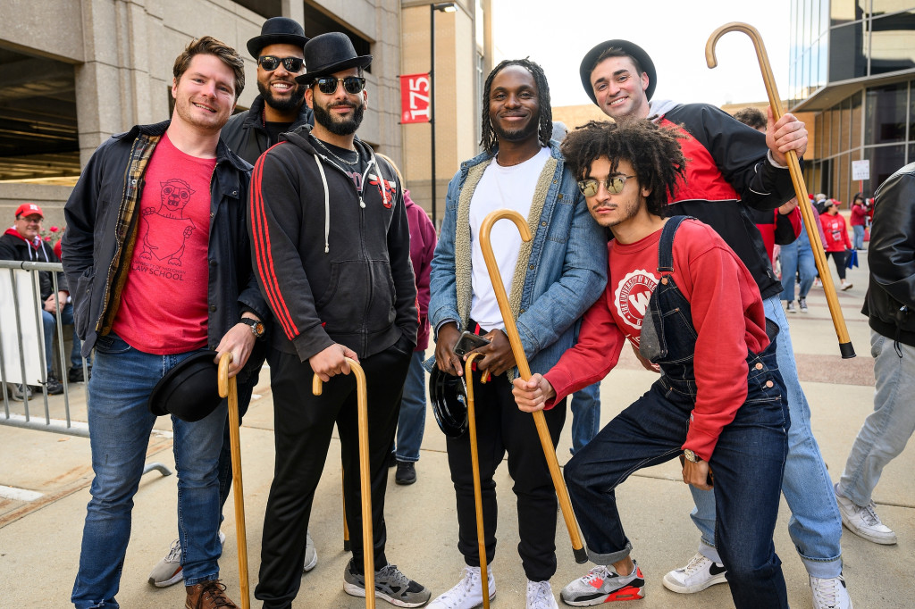 A group of law students pose with wooden canes