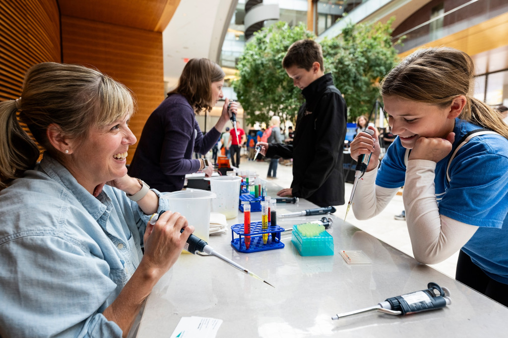 Students work on experiments at a table.