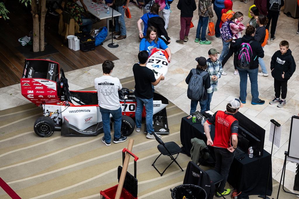Students display a race car.