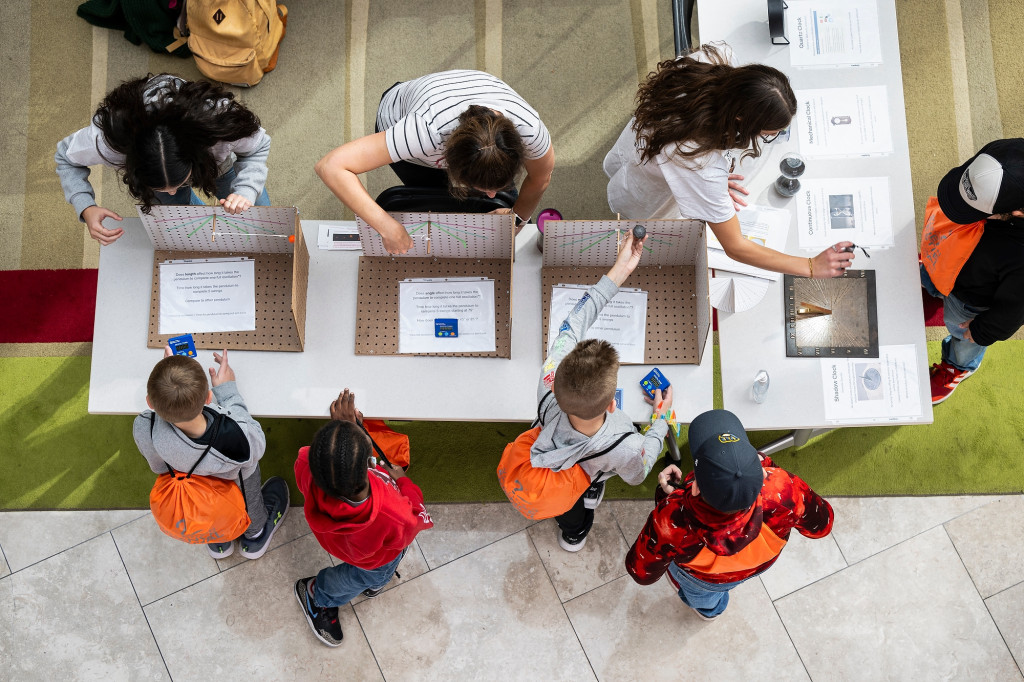 A view from above at some students working at a table.