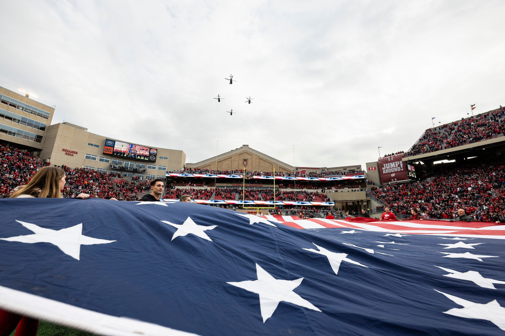 A flag is displayed with helicopters visible.