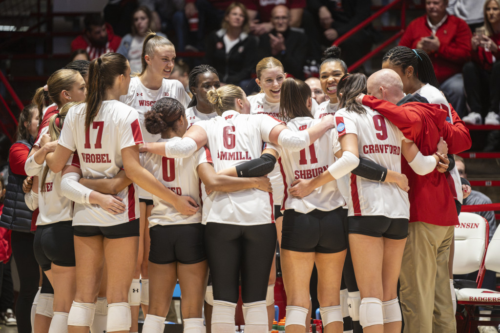The team huddles with head coach Kelly Sheffield during the Miami game.