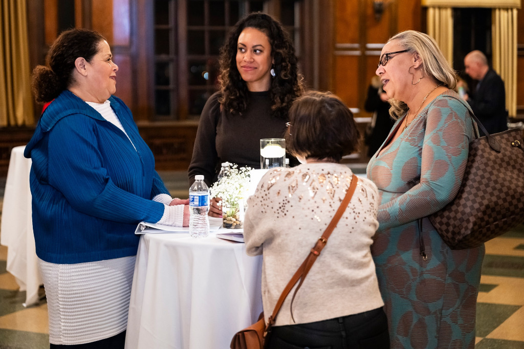 At left, writer and actress Anna Deavere Smith talks with Jessica Stovall (center, Anna Julia Cooper Fellow in the Department of African American Studies), Erica Halverson, professor of education, and Dana Pellebon, Dane County board supervisor and executive director of the Rape Crisis Center, during a private reception in Deavere Smith’s honor in Tripp Hall in the Memorial Union.