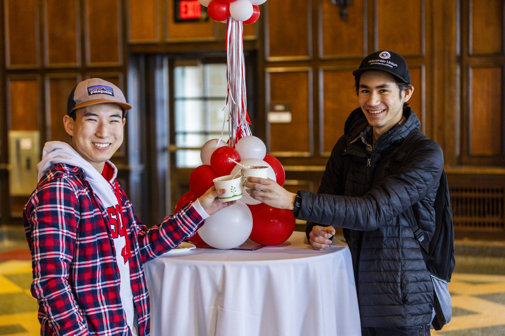 Jeff Messer (left), a third-year political science major, and Gavin Escott, a third-year political science and Chinese major, toast to the university’s 175th anniversary in Tripp Commons.