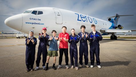 From left to right, Khawlah Ahmad Alharbi, Xuepeng Jiang, Renjie Nie, Hantang Qin, Rayne Wolf, Pengyu Zhang and Jacob Kocemba pose beside G-Force One, the jet in which they tested their zero-gravity 3D printing technique.