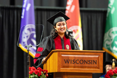 A woman speaks at a podium.