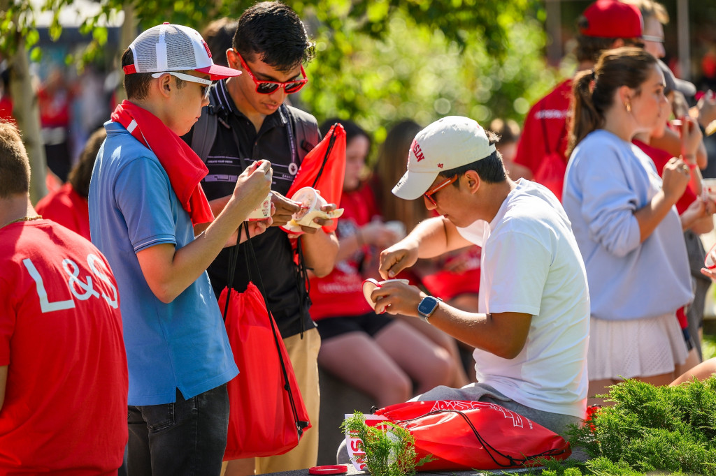 Students dig into their ice cream cups.