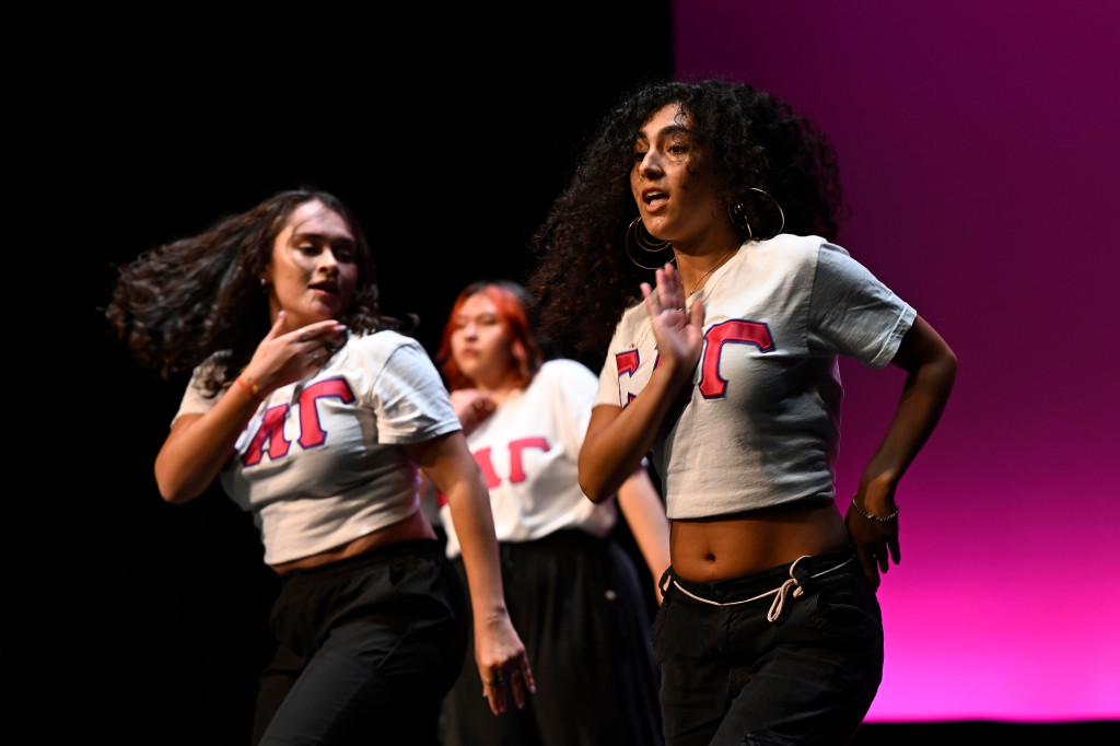 A group of people perform on stage.