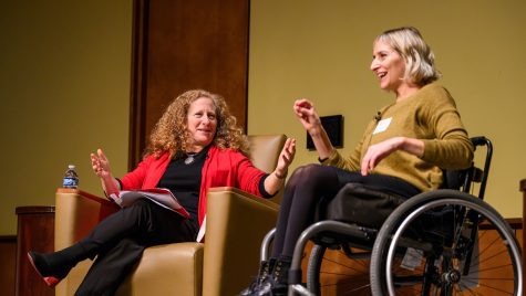 Chancellor Mnookin sits on stage with Rebekah Taussig, who uses a wheelchair, as they discuss Taussig's book Sitting Pretty.