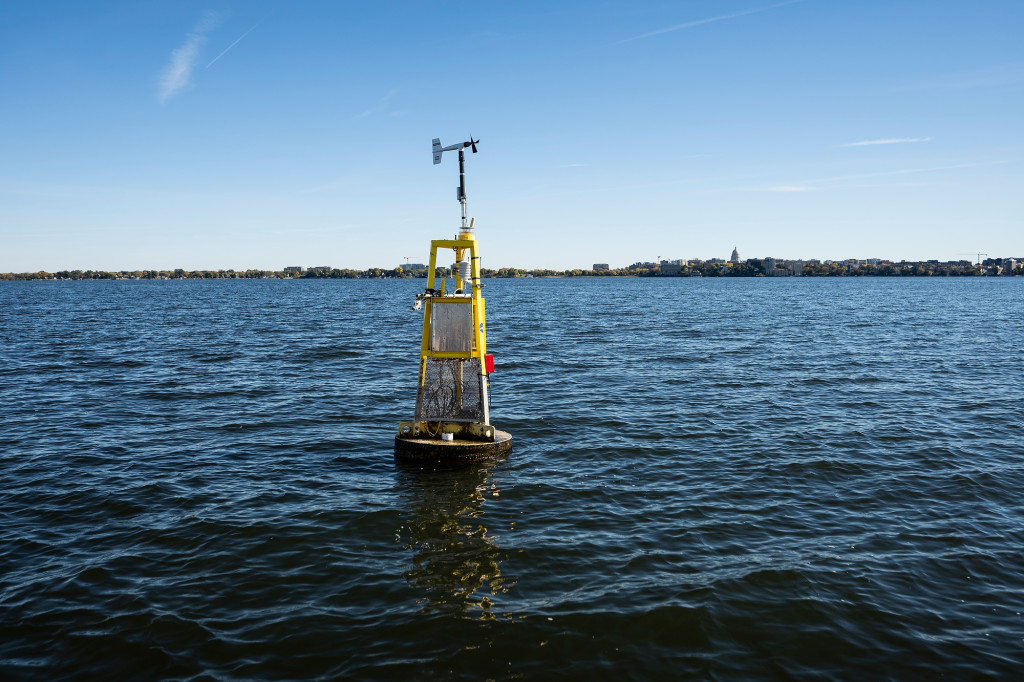 Buoy floats on lake water.