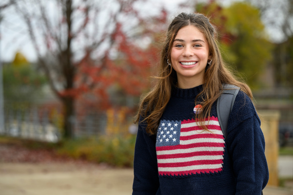 A young woman smiles for the camera.