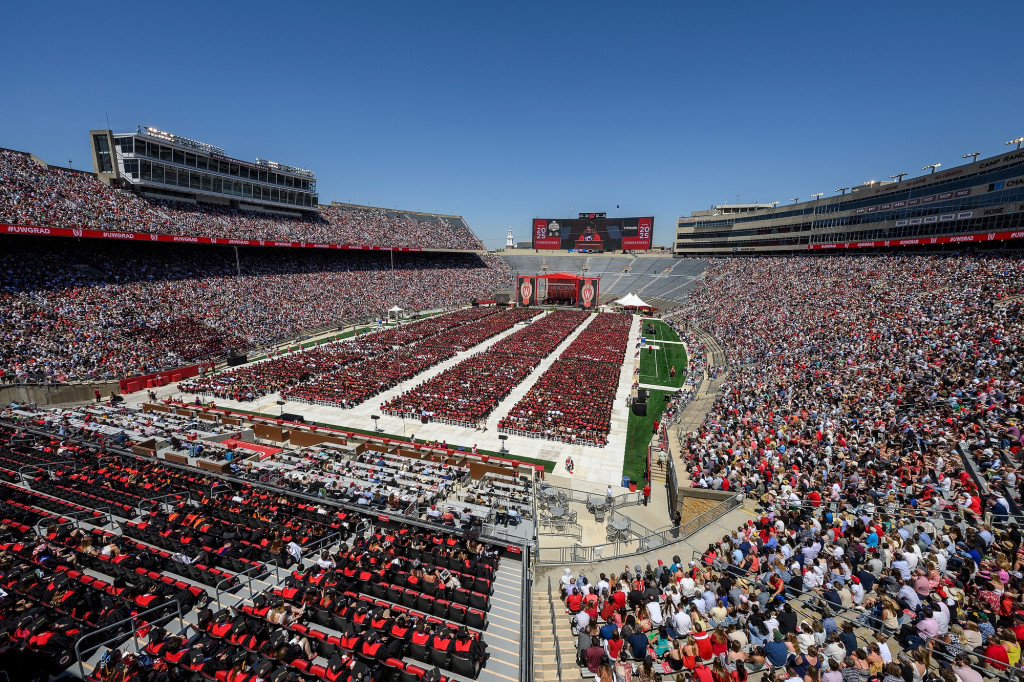 A stadium full of people is shown.