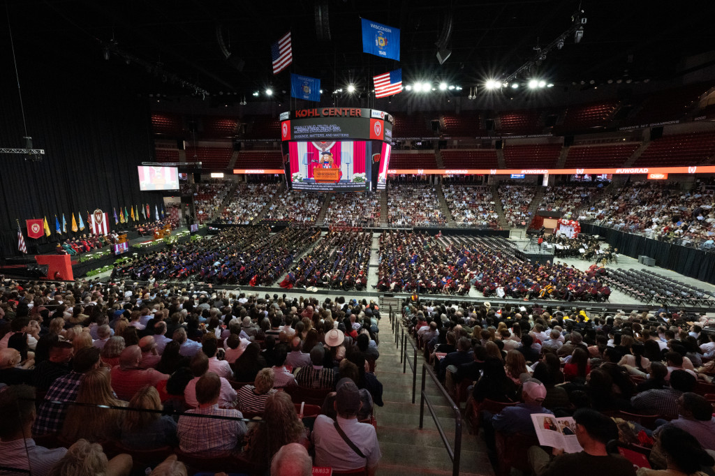 A wide angle view of the Kohl Center's interior filled with people in the seats.