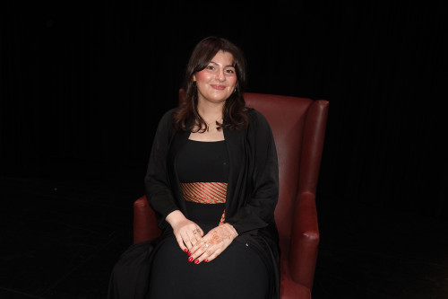 Jenna Innab sits for a studio portrait