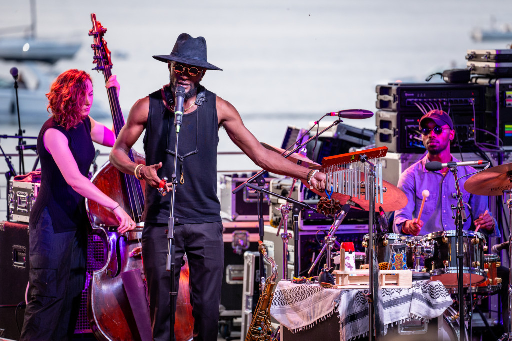 A band is shown on stage performing.