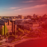Aerial photo of the Red Gym, Memorial Union and the Lake Mendota shoreline with a transparent red gradient overlaid on the image