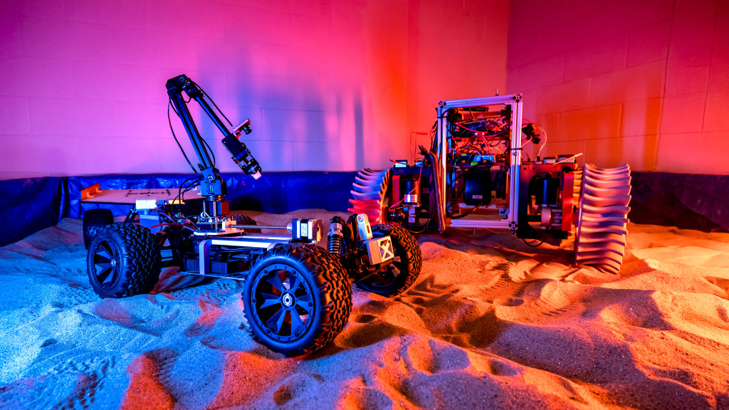A rover is seen operating on sand.