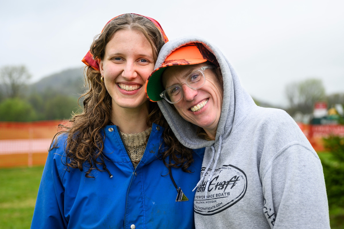 Widell and Caroline Gottschalk Druschke lean together and smile for a photo.