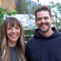 Meagan Hahn and Shawn Wiederhoeft stand together outdoors, smiling.