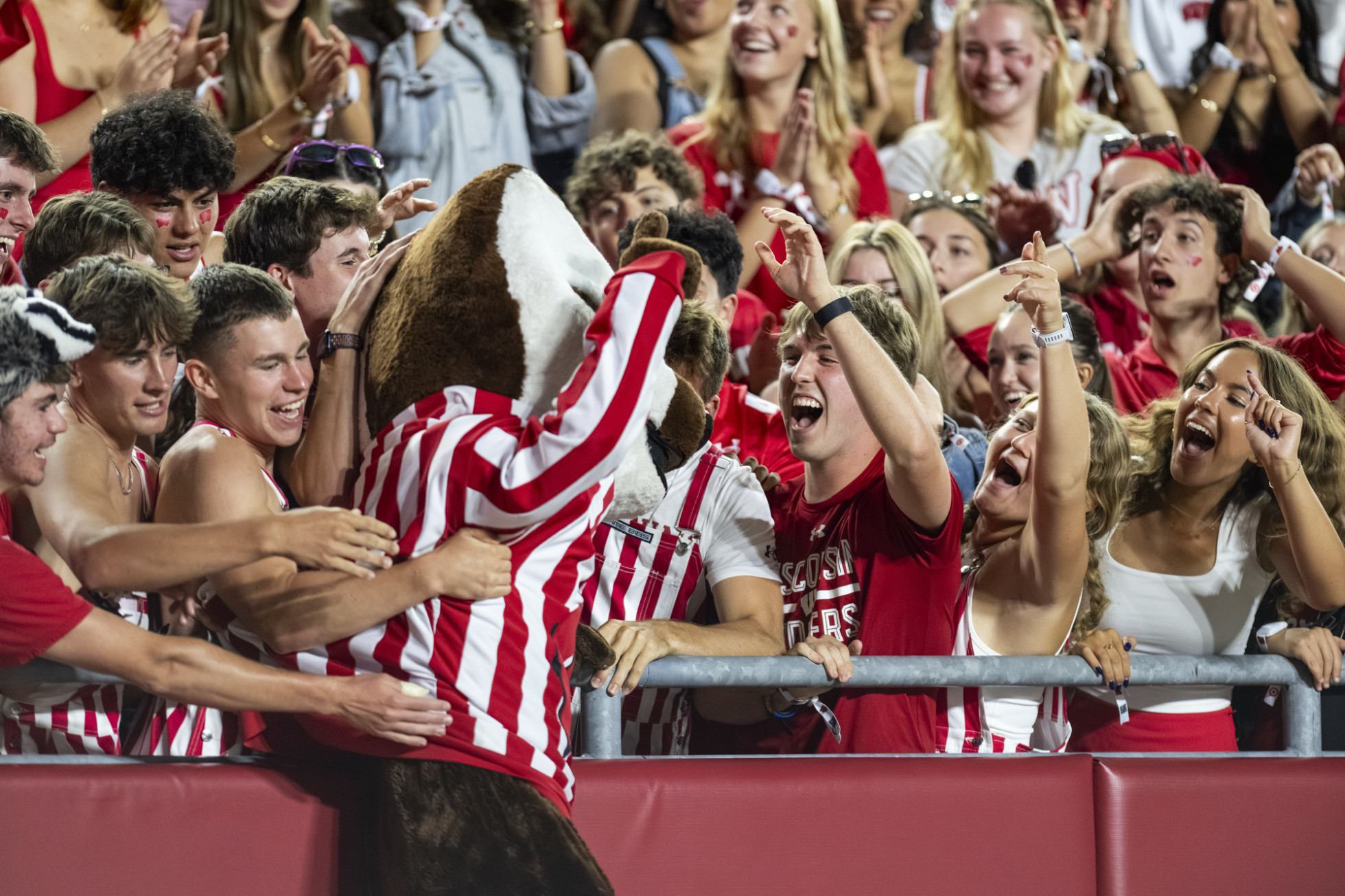Bucky Badger jumps into the student section at Camp Randall. 