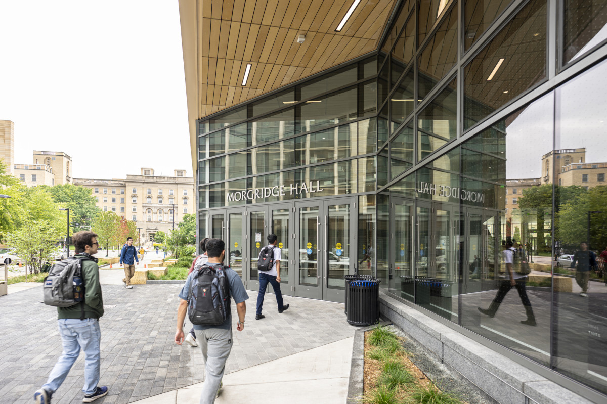 Students approach the front doors of the newly opened Morgridge Hall.