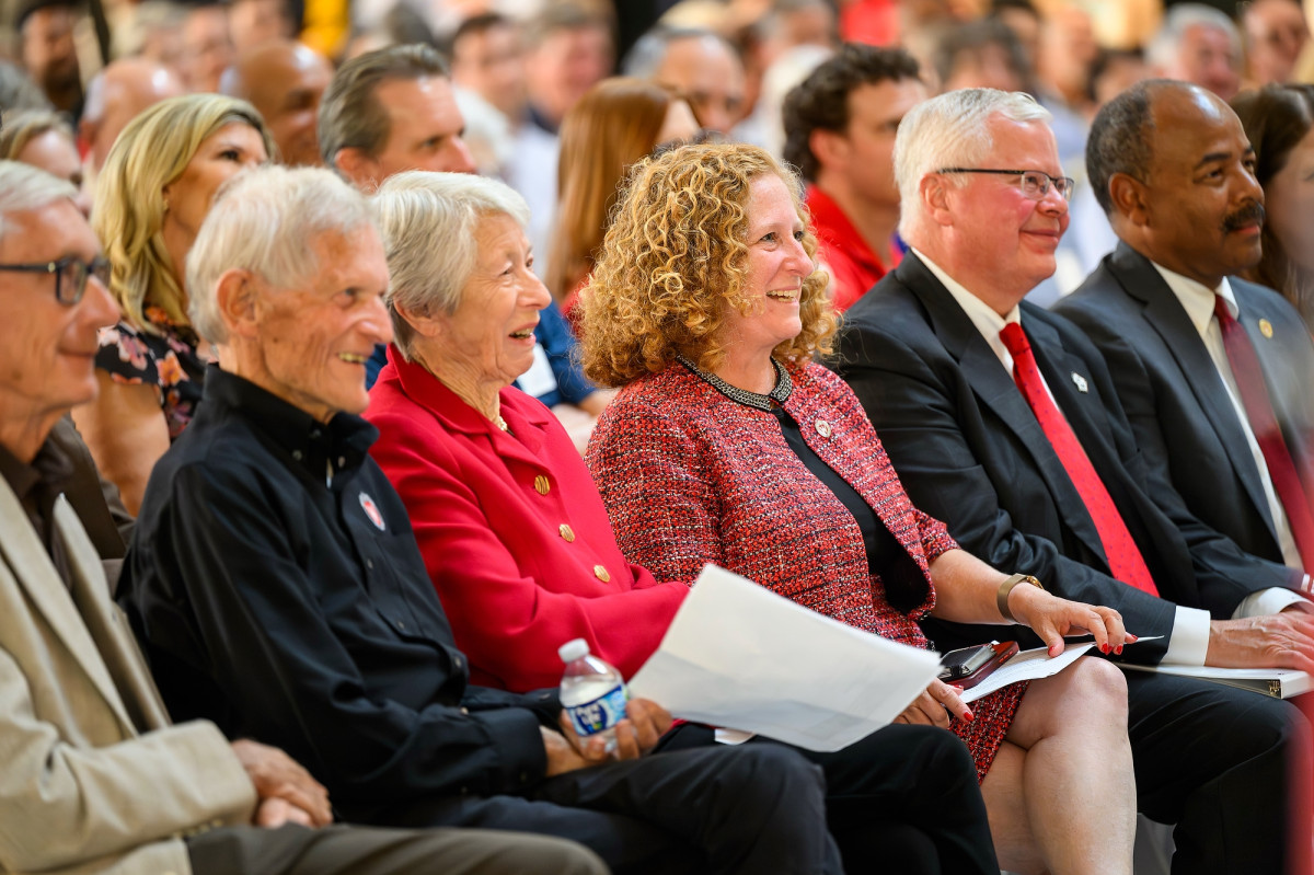 Evers, John Morgridge, Tashia Morgridge, Chancellor Mnookin, Jay Rothman and Eirc Wilcots sit in the front row of the crowd.